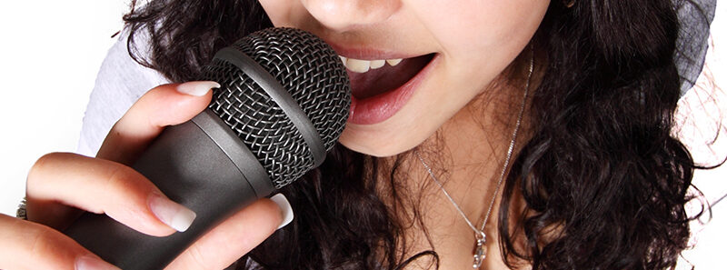 a woman holding a microphone