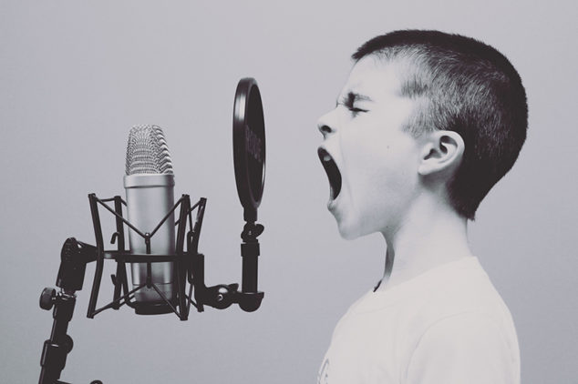 a young boy singing